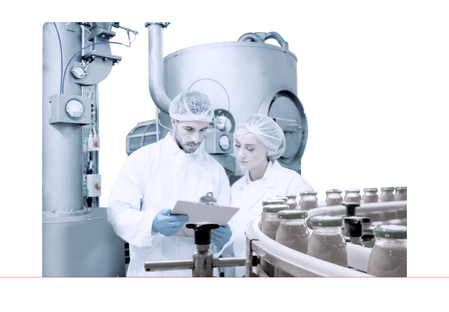 Two scientist reading a report near a assembly line 